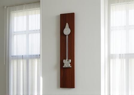 Contemporary clockwork sculpture using reclaimed mahogany and stainless steel